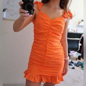 Orange ruffle mini dress